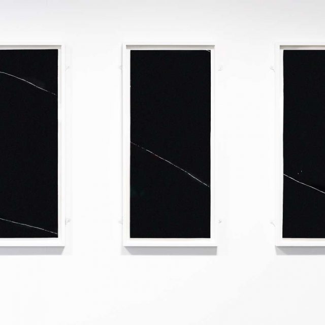 There are three black rectangles side by side on the screen.