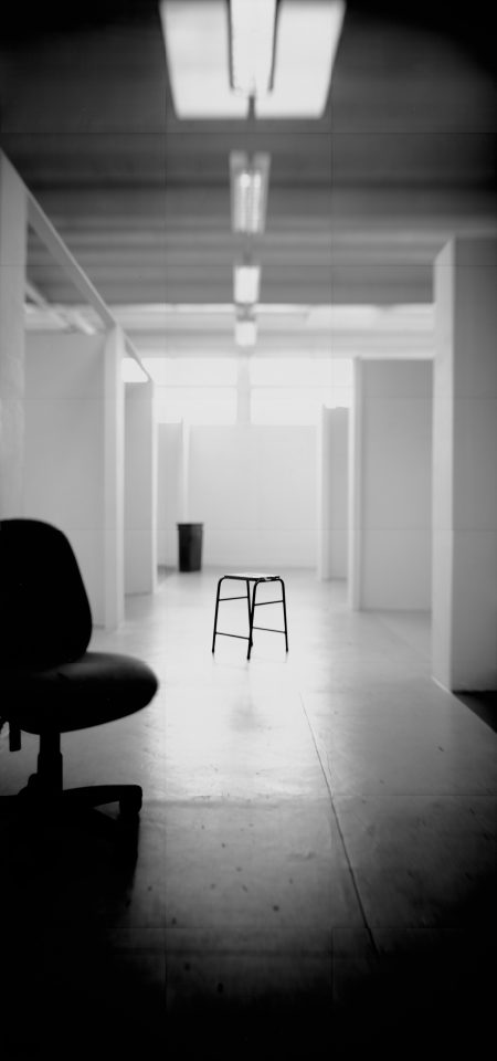 Several chairs are placed in a hallway.