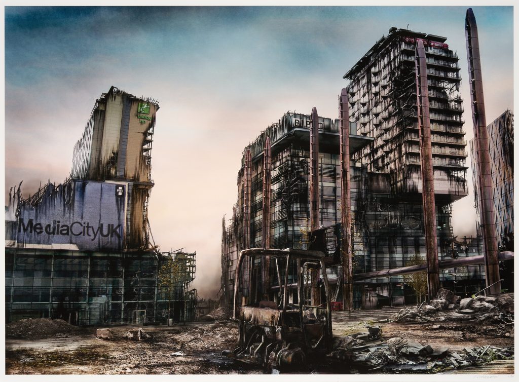 A view of a desolate and destructed post-apocalyptic Media City with an abandoned forklift loader in the centre.