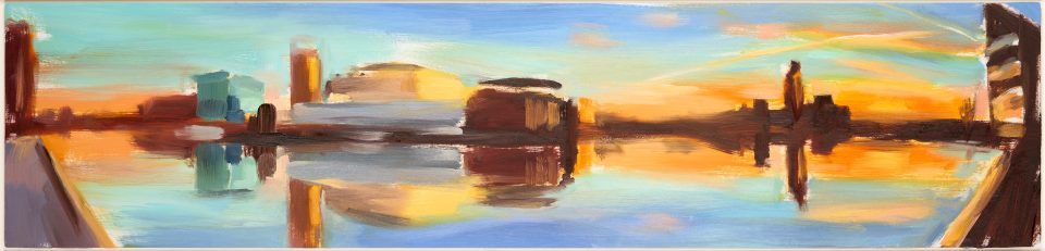 A painting depicts a view of Salford Quay's where the bulidings along the waterfront are refelcted in the water. The abstracted buildings in greys, browns, and blues run across the middle of the painting, while the sky and refelction surronds them, blue at the top and bottom, turning golden at the centre.